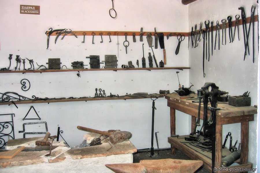 Blacksmith tools arranged in the museum workshop