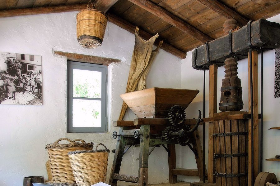 Traditional tools and domestic objects displayed in a museum room